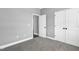 Neutral colored bedroom with carpeted floor, open door and closet that enhances the spacious layout and accessibility at 91 Laramie Ln, Selma, NC 27576