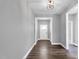 Entryway with gray walls, wood floors, and a white front door with glass at 91 Laramie Ln, Selma, NC 27576