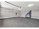 Spacious two-car garage with ample storage space and smooth concrete flooring at 91 Laramie Ln, Selma, NC 27576
