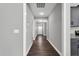 Inviting hallway features hardwood floors, neutral paint, and modern lighting at 91 Laramie Ln, Selma, NC 27576