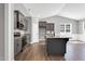 Kitchen featuring dark cabinets, granite countertops, and stainless steel appliances at 91 Laramie Ln, Selma, NC 27576