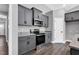 Kitchen featuring granite countertops, grey cabinets, and stainless steel appliances at 91 Laramie Ln, Selma, NC 27576