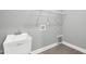 Functional laundry room with utility sink and tiled flooring providing a clean and efficient space for laundry tasks at 91 Laramie Ln, Selma, NC 27576