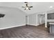 Open-concept space featuring hardwood floors and access to kitchen appliances at 91 Laramie Ln, Selma, NC 27576