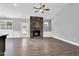 Spacious living room with stone fireplace, hardwood floors, and abundant natural light at 91 Laramie Ln, Selma, NC 27576