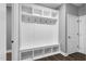 A well-organized mudroom with cubbies, hooks, and a bench provides functional storage and a convenient entry area at 91 Laramie Ln, Selma, NC 27576