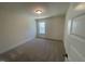 Comfortable bedroom with neutral carpet, and a window with a view of lush greenery at 113 Arundel Dr, Archer Lodge, NC 27527