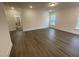 Spacious bedroom with hardwood flooring, recessed lighting, and large windows offering plenty of sunlight at 113 Arundel Dr, Archer Lodge, NC 27527