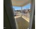 View of the spacious deck with black metal railing overlooking the neighborhood at 113 Arundel Dr, Archer Lodge, NC 27527