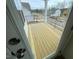 View of the spacious deck with black metal railing overlooking the neighborhood at 113 Arundel Dr, Archer Lodge, NC 27527
