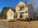 Beautiful two-story home with a two car garage, a small porch, and manicured landscaping at 113 Arundel Dr, Archer Lodge, NC 27527