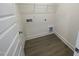Practical laundry room with hard surface flooring and utility connections for appliances at 113 Arundel Dr, Archer Lodge, NC 27527