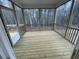 Cozy screened-in porch with wood flooring, perfect for enjoying the outdoors in comfort at 113 Arundel Dr, Archer Lodge, NC 27527