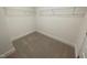 Functional walk-in closet with carpet and white wire shelving, providing organized storage space at 113 Arundel Dr, Archer Lodge, NC 27527