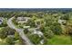 Aerial view of a home surrounded by mature trees near a community at 1146 Rogers Rd, Graham, NC 27253