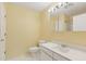 Bathroom boasts a toilet, sink, vanity and mirror at 1146 Rogers Rd, Graham, NC 27253