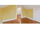 Sunny bedroom with wood floors and a closet in an older home that could use some updating at 1146 Rogers Rd, Graham, NC 27253