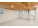 This bedroom has carpeted floors, white walls and a wood plank ceiling at 1146 Rogers Rd, Graham, NC 27253