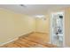 A bedroom features wood floors and a view into the attached bathroom at 1146 Rogers Rd, Graham, NC 27253