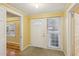 Welcoming entryway with a neutral color scheme, and a white front door at 1146 Rogers Rd, Graham, NC 27253