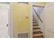 Hallway featuring a staircase and doorways at 1146 Rogers Rd, Graham, NC 27253