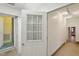 Hallway with doors leading to various rooms at 1146 Rogers Rd, Graham, NC 27253