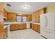 Classic kitchen with wooden cabinets and modern appliances at 1146 Rogers Rd, Graham, NC 27253