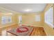 Charming living room boasting beautiful hardwood floors and large windows at 1146 Rogers Rd, Graham, NC 27253