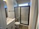 Modern bathroom featuring a glass-enclosed shower, stylish vanity, and contemporary fixtures at 115 Arundel Dr, Archer Lodge, NC 27527
