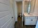 Bathroom features a vanity with a white countertop and a view of toilet and into an adjacent room at 115 Arundel Dr, Archer Lodge, NC 27527