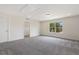 Bedroom featuring gray carpet, a window, and a closet at 115 Arundel Dr, Archer Lodge, NC 27527