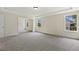 Spacious primary bedroom with tray ceilings and large windows at 115 Arundel Dr, Archer Lodge, NC 27527
