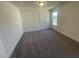 Bedroom features neutral carpet, double closet doors, and a window providing natural light at 115 Arundel Dr, Archer Lodge, NC 27527