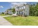 Charming two-story house with a well-maintained lawn and landscaping, and a mix of siding and stone accents at 115 Arundel Dr, Archer Lodge, NC 27527