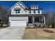 Charming two-story home with a two-car garage and inviting front porch at 115 Arundel Dr, Archer Lodge, NC 27527