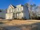 New construction home with a well-manicured lawn and a welcoming front porch at 115 Arundel Dr, Archer Lodge, NC 27527