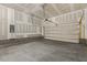 Spacious two-car garage with sealed floors, overhead door, and electric door opener at 115 Arundel Dr, Archer Lodge, NC 27527