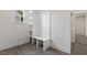 Mud room with built-in storage, seating, and neutral finishes at 115 Arundel Dr, Archer Lodge, NC 27527