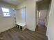 Well-lit mudroom with custom built-in storage and durable wood-look flooring at 115 Arundel Dr, Archer Lodge, NC 27527