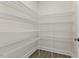 A well-organized walk-in pantry with wire shelving in a new home at 115 Arundel Dr, Archer Lodge, NC 27527