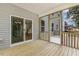 Covered porch with views of home's interior and the backyard at 115 Arundel Dr, Archer Lodge, NC 27527