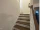 Interior shot of a carpeted staircase leading to the upper level of a home at 115 Arundel Dr, Archer Lodge, NC 27527
