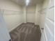 Spacious walk-in closet with ample shelving, ready for organization and storage at 115 Arundel Dr, Archer Lodge, NC 27527