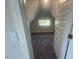 Attic bonus room with carpet flooring and a window at 116 Arundel Dr, Archer Lodge, NC 27527