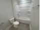 Bathroom featuring a bathtub, shower, and a toilet at 116 Arundel Dr, Archer Lodge, NC 27527