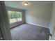 Bedroom with carpet flooring, a window, and a neutral color scheme at 116 Arundel Dr, Archer Lodge, NC 27527