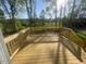 Wooden deck overlooking lush greenery and providing a serene outdoor space at 116 Arundel Dr, Archer Lodge, NC 27527