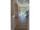 Inviting entryway with hardwood floors leading to a bright and open living area with a modern chandelier at 116 Arundel Dr, Archer Lodge, NC 27527