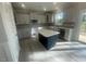 Well-appointed kitchen with white cabinets, an island, and modern stainless steel appliances at 116 Arundel Dr, Archer Lodge, NC 27527