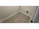 Practical laundry room with tiled floor, utility hookups, and fresh paint at 116 Arundel Dr, Archer Lodge, NC 27527